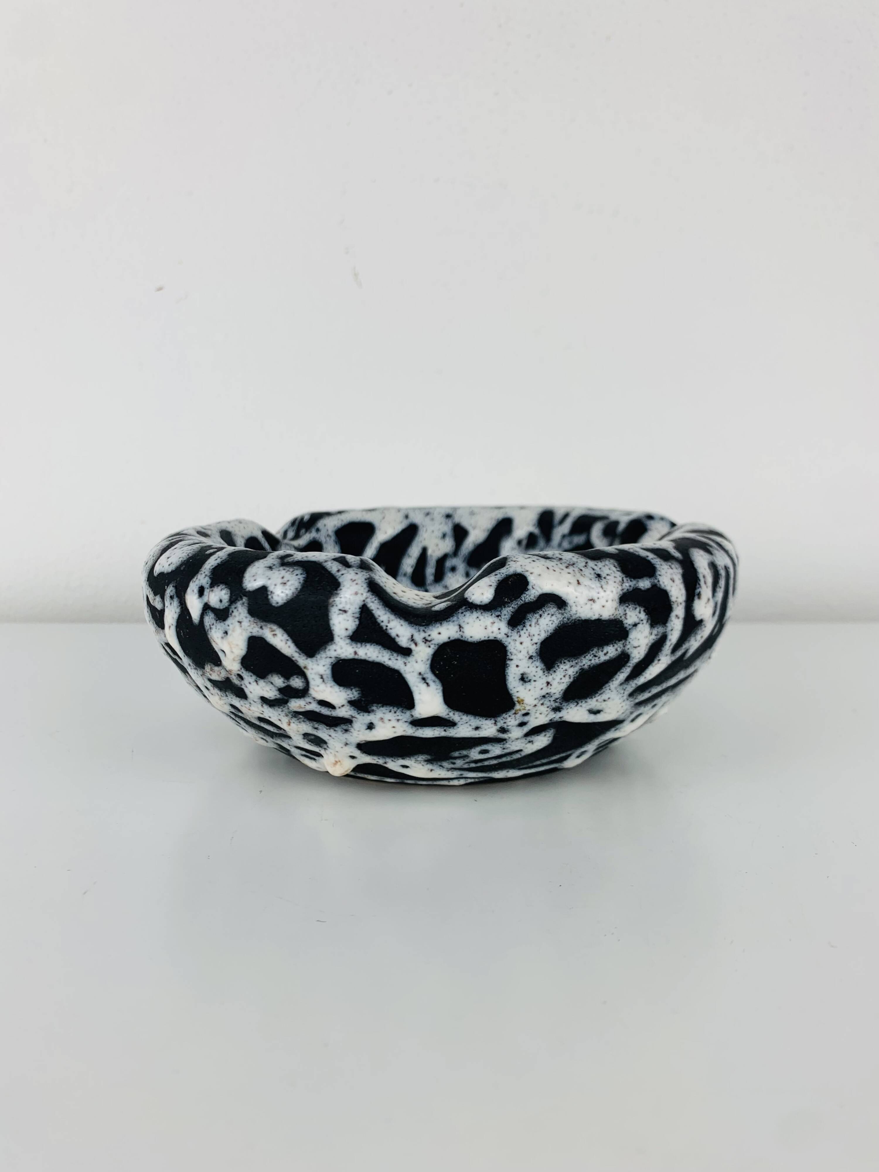 Ashtray and pocket tray by Marius Giuge, fat lava ceramic.