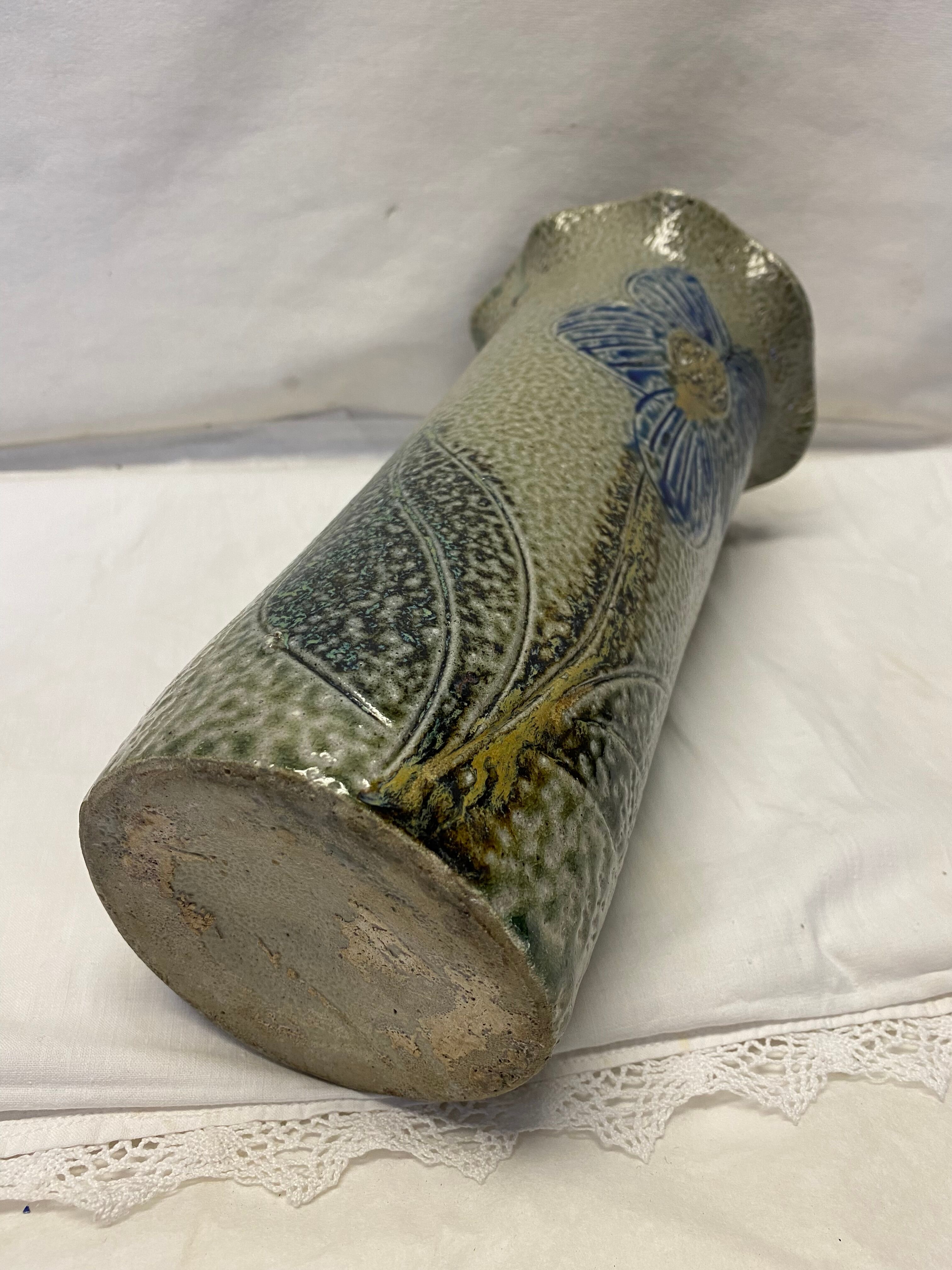 Artisanal vase in gray sandstone flower pattern