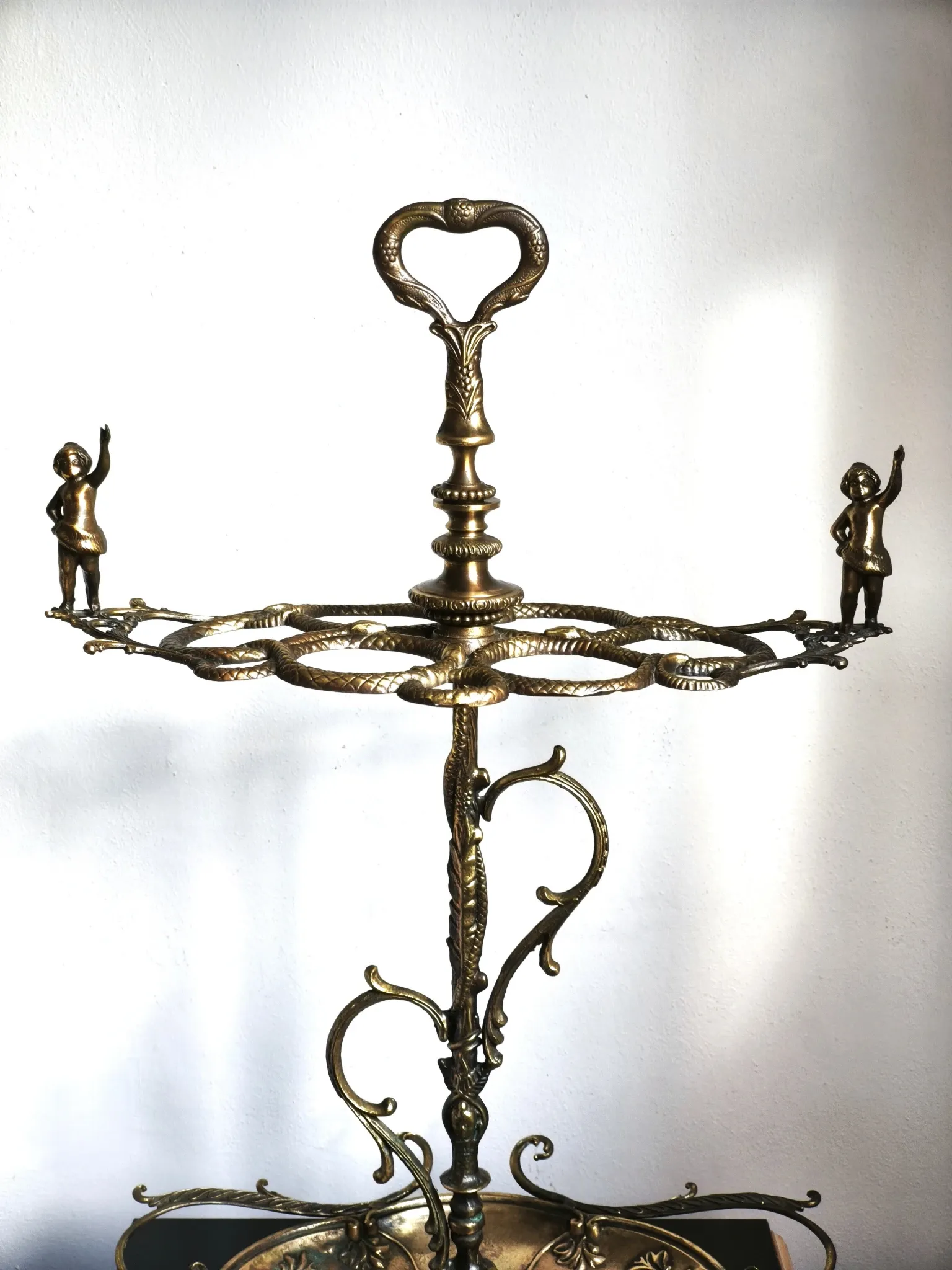 Italian brass umbrella stand, Art Nouveau style, with putti.