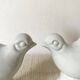 Pair of porcelain candle holders and bird vases
