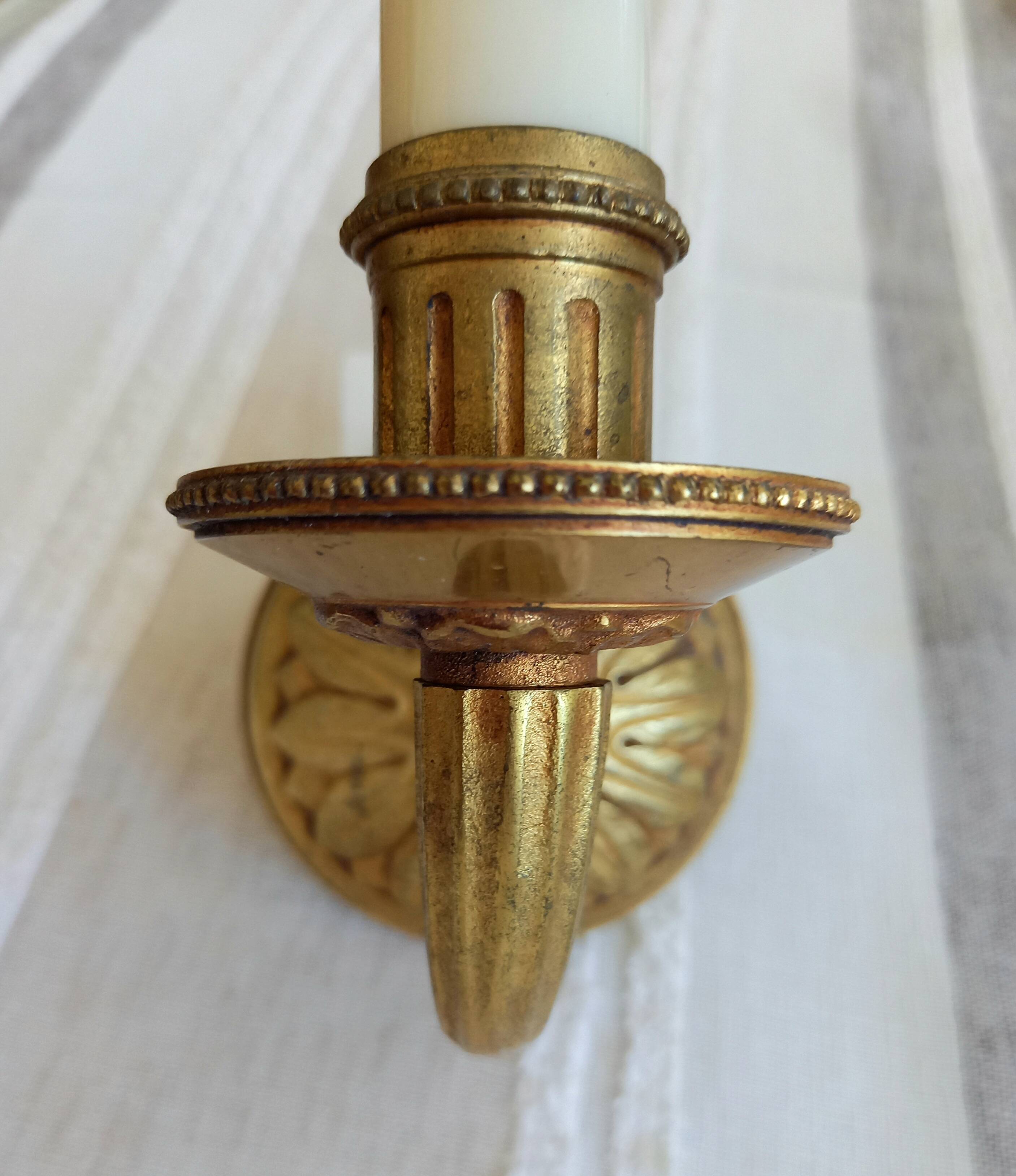 Electrified bronze gold wall sconces... in pairs.