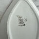 Longwy ramekin with blue and orange floral decoration.