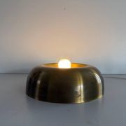 Flush-mounted disc-shaped brass fixture from the mid-century, 1960, Italy.