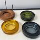 Set of 3 stackable glass catchalls with a teak base.