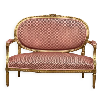 Louis XVI style sofa in gilded wood