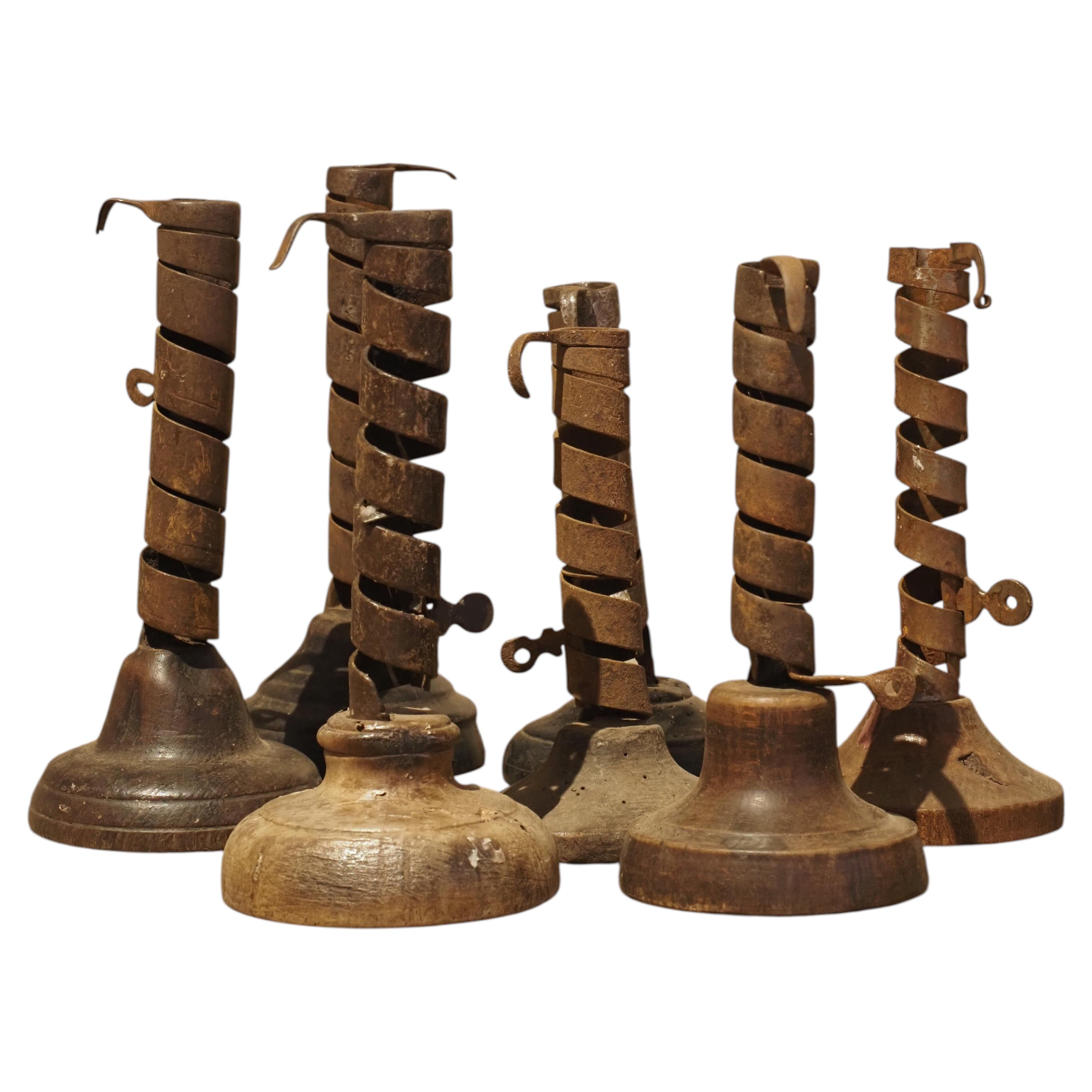 19th-century wrought iron "Rat de Cave" candlesticks from Normandy, set of 7.
