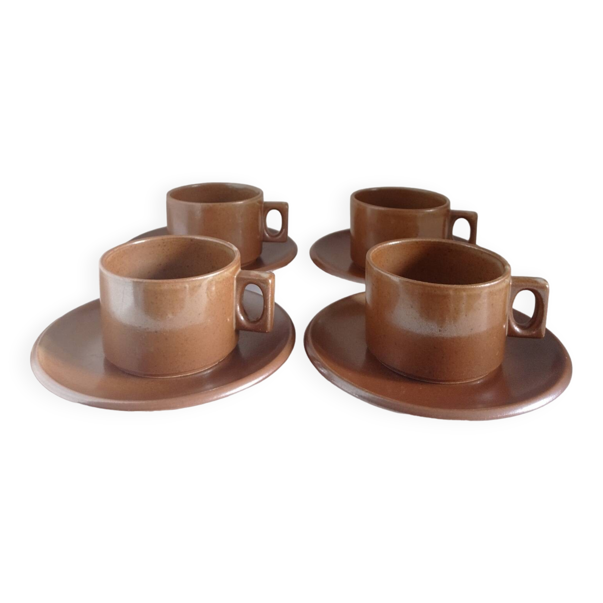 Stoneware coffee cups and saucers