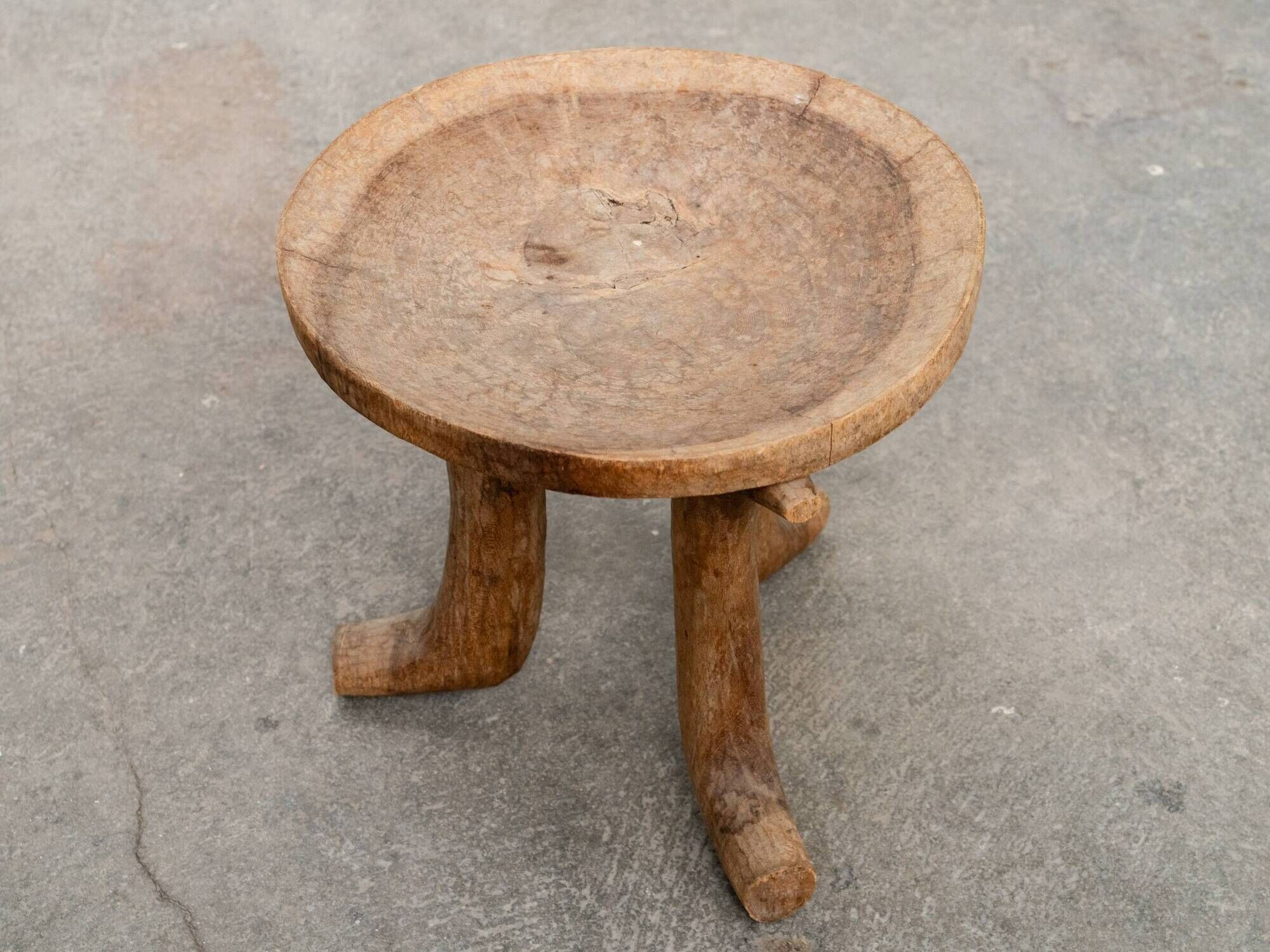 Ancient primitive monoxyle tripod stool from Ethiopia, Wanza wood.