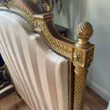 Pair of late 19th-century gilded wooden beds in Louis XVI style.