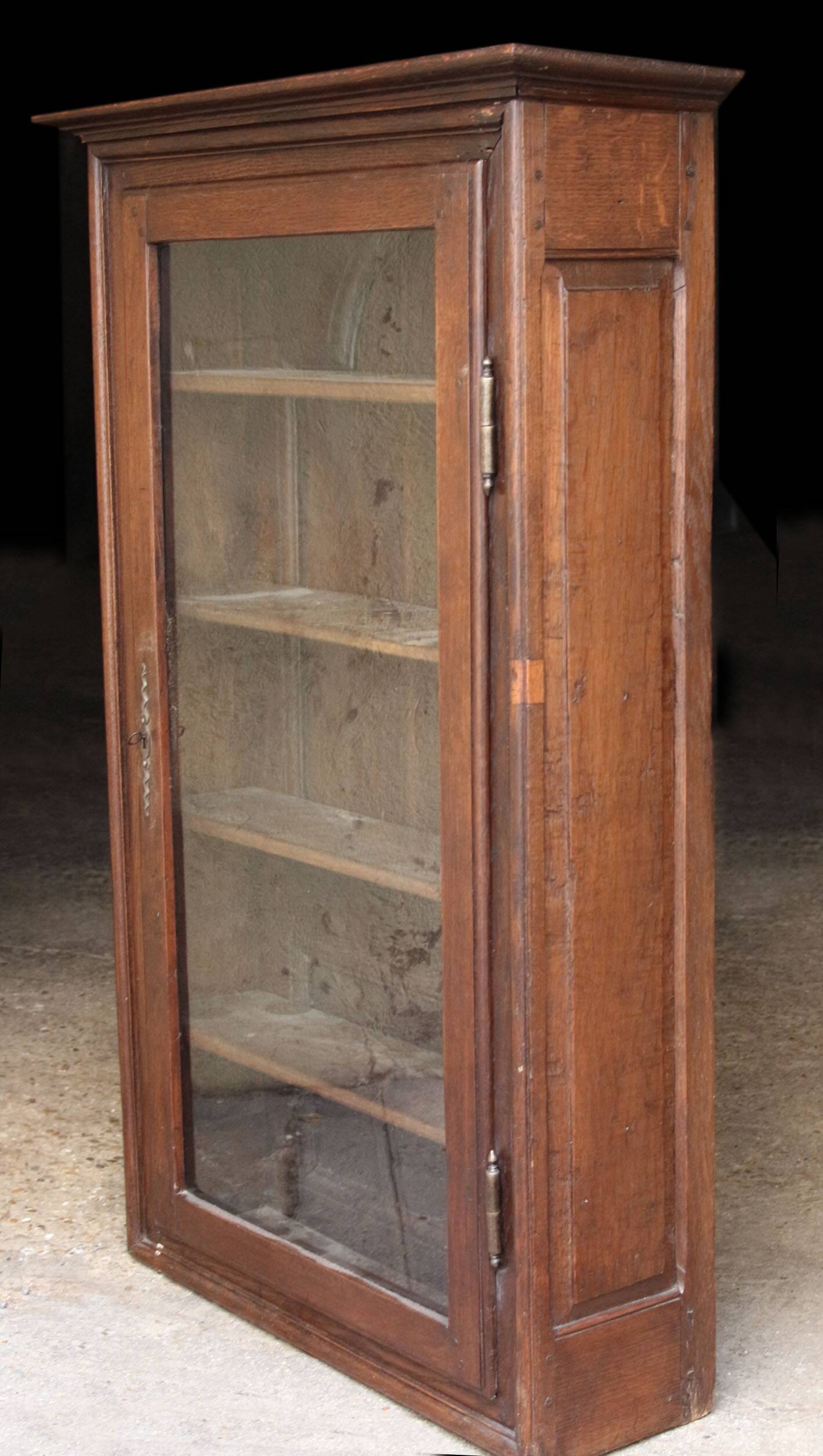 Elegant 18th century solid oak display cabinet.
