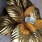 Golden metal flower sconce