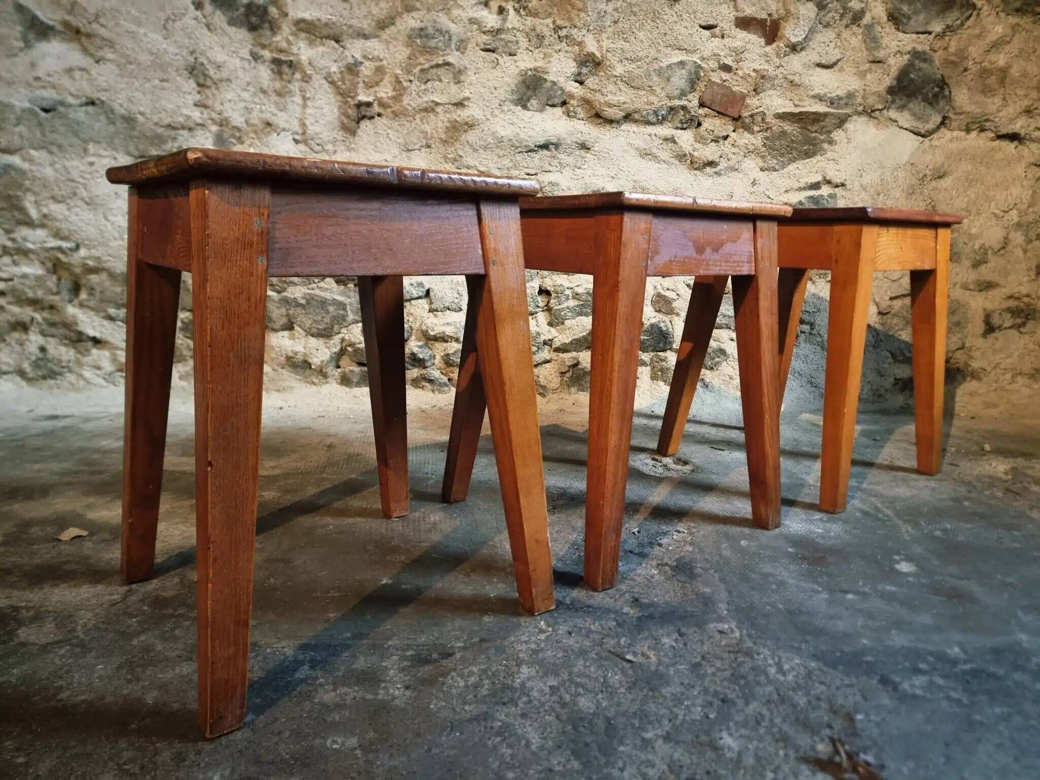Set of 3 vintage French wooden stools from the 1950s.