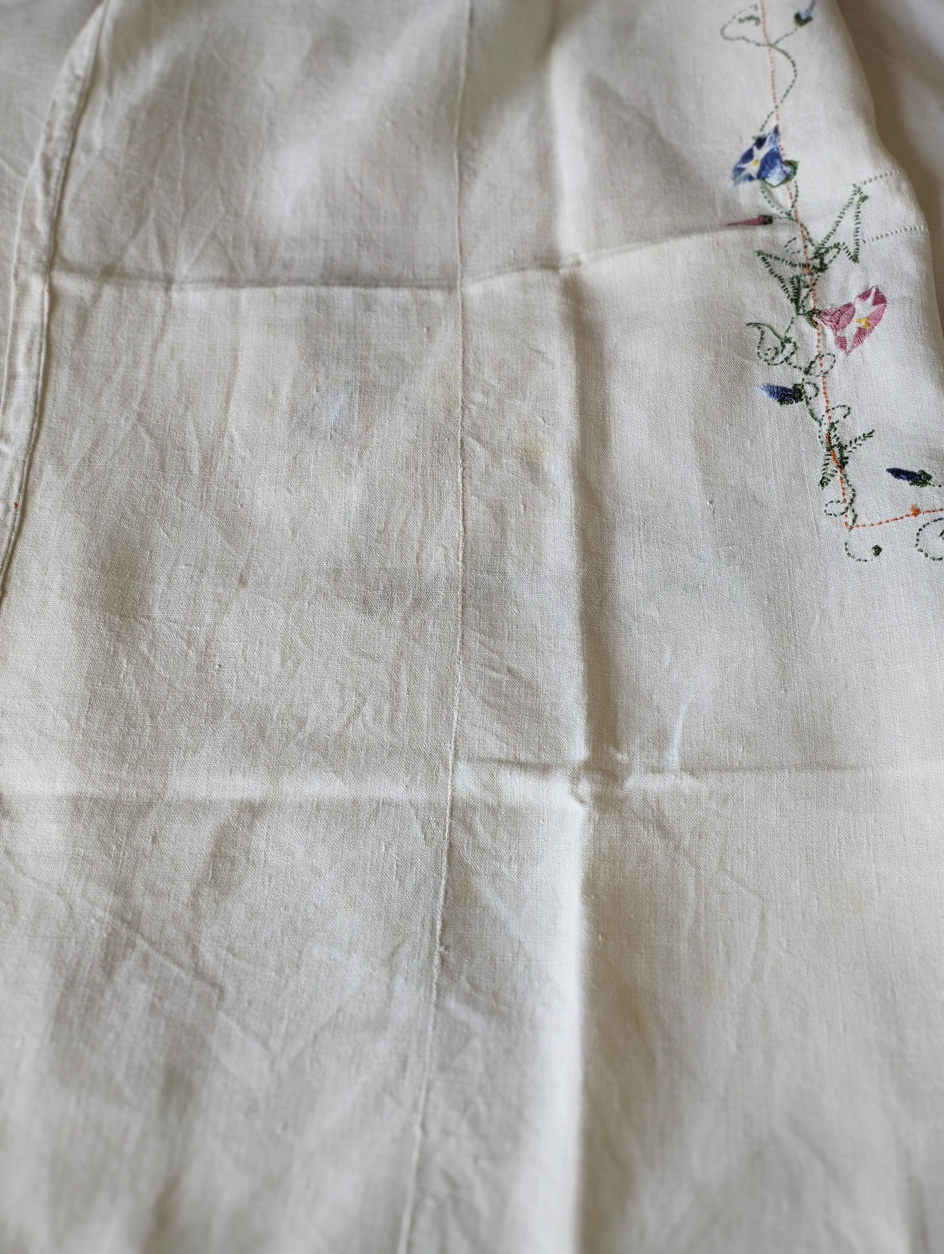 Antique linen tablecloth embroidered with flowers