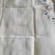 Antique linen tablecloth embroidered with flowers