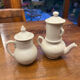 Antique white earthenware teapot, individual service with filter.
