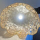 Large mother-of-pearl and brass chandelier with floral decoration.