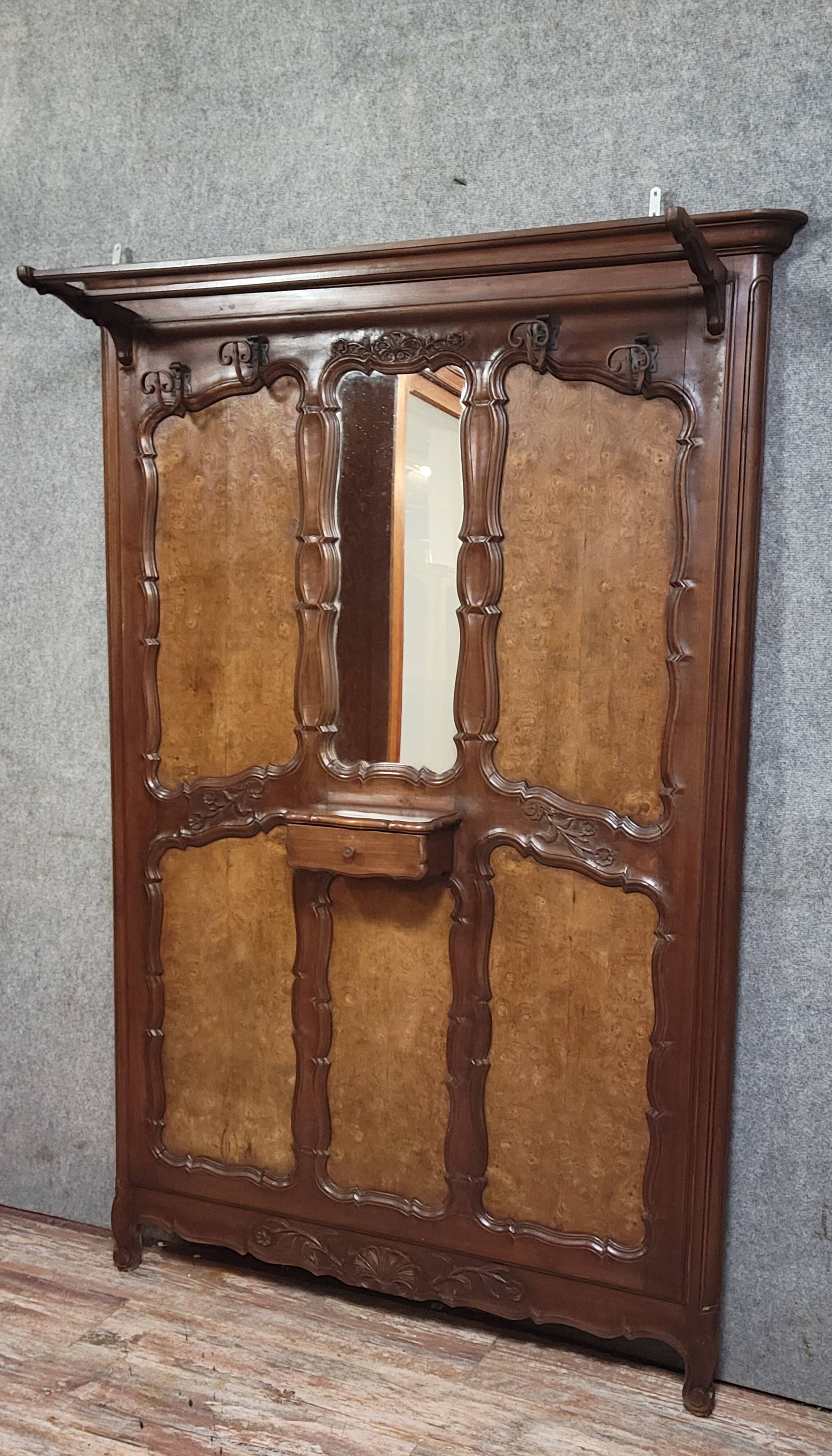 Large coat rack in Louis XV style, made of walnut and elm burl.