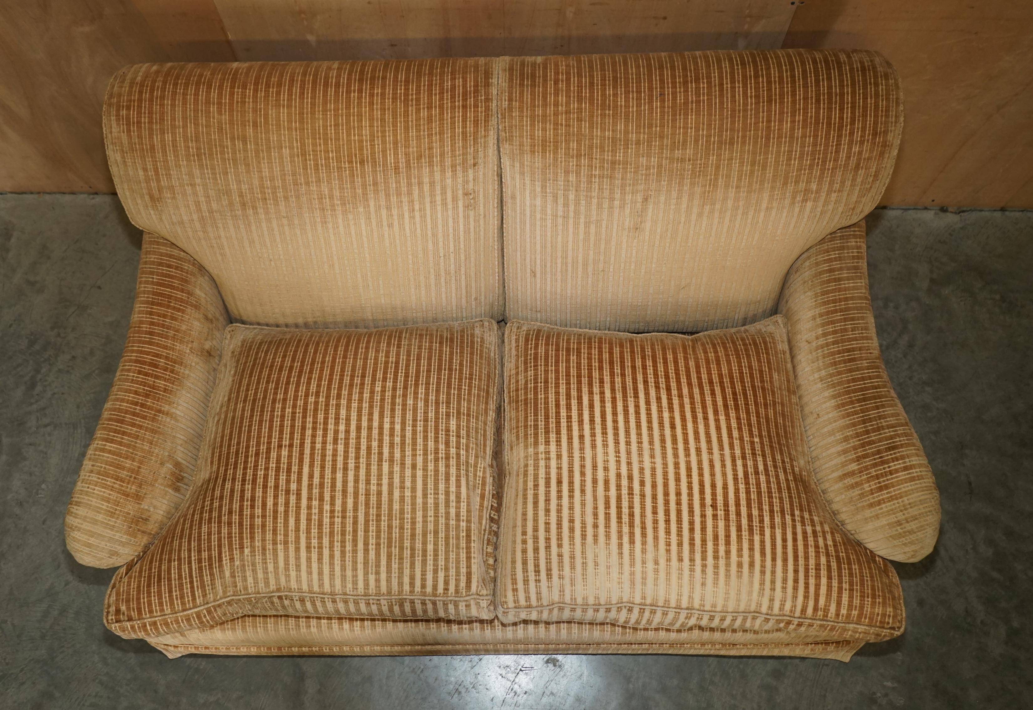 Howard & Sons / Chairs Ltd two-seater canapé with feather-filled cushions.