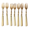 Set of 7 small golden bakelite dessert forks