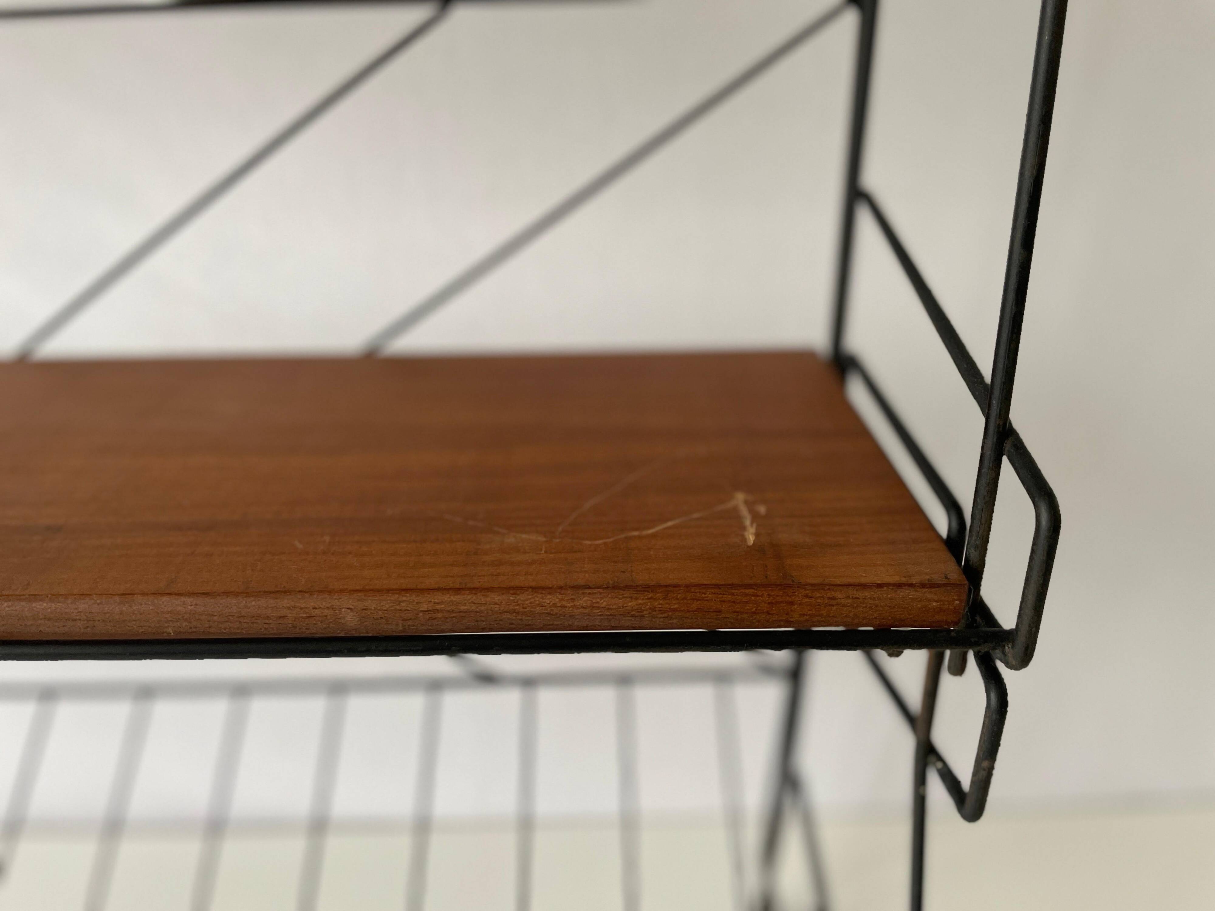 Free-standing shelf with a metal structure and 3 shelves, 1960s, Italy.