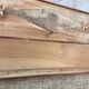 Large antique wardrobe made of wood and burlap.