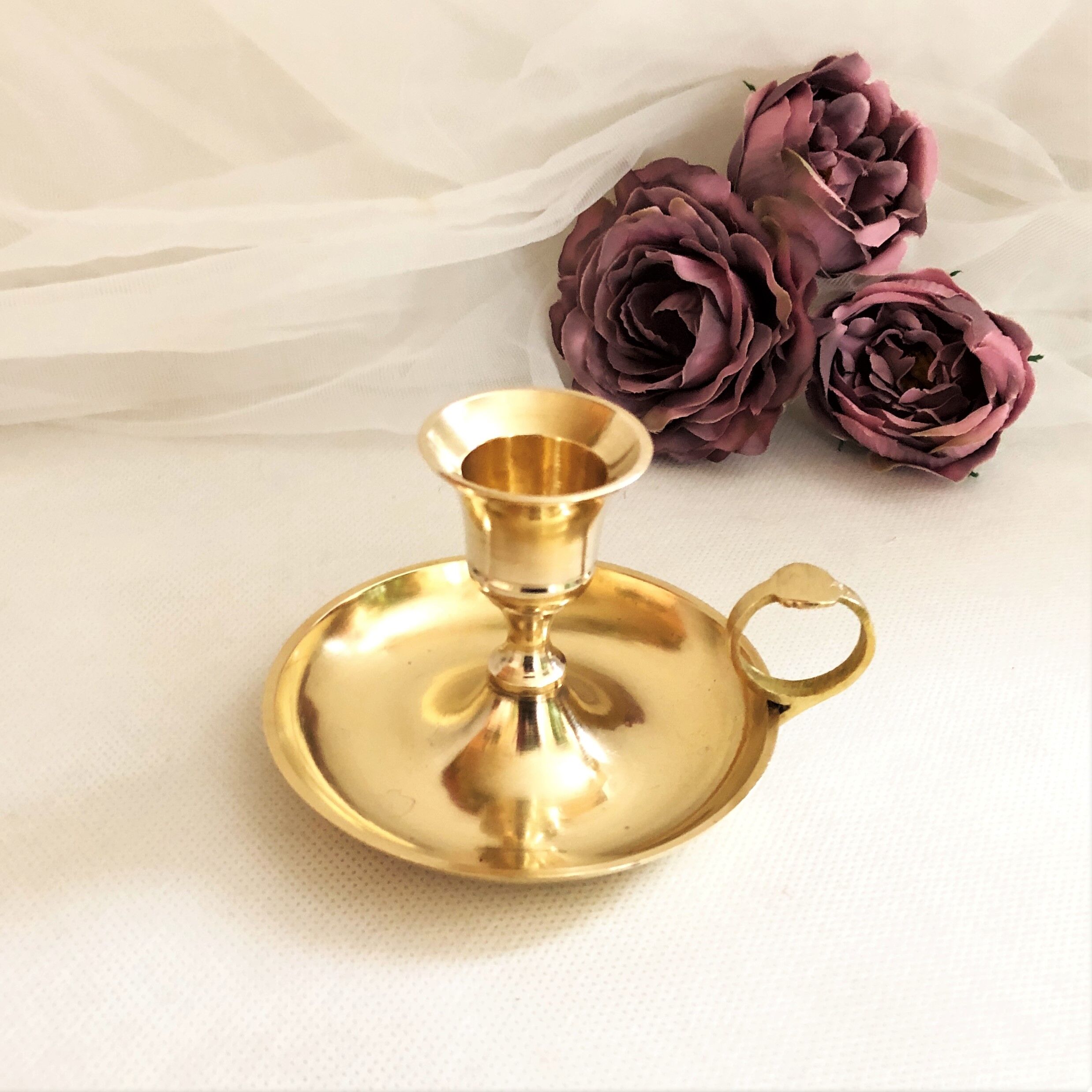 Gilded brass hand candle holder