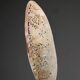 Perforated shell hand-decorated on a wooden base