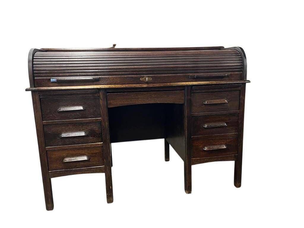 Vintage American wooden desk with a roll-top.