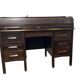Vintage American wooden desk with a roll-top.