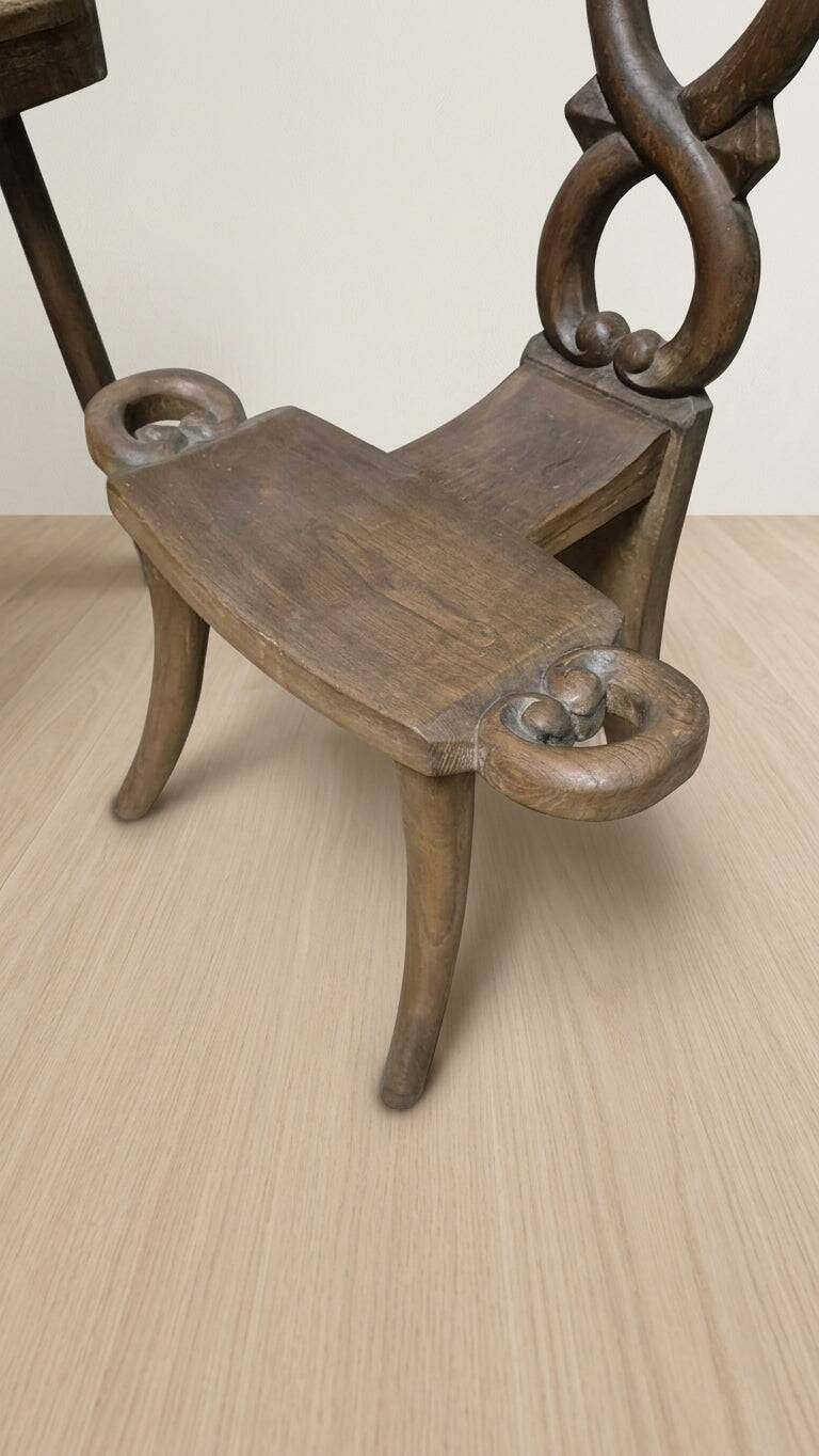 Vintage sculptural wooden table and two chairs, hand-carved loop backrests