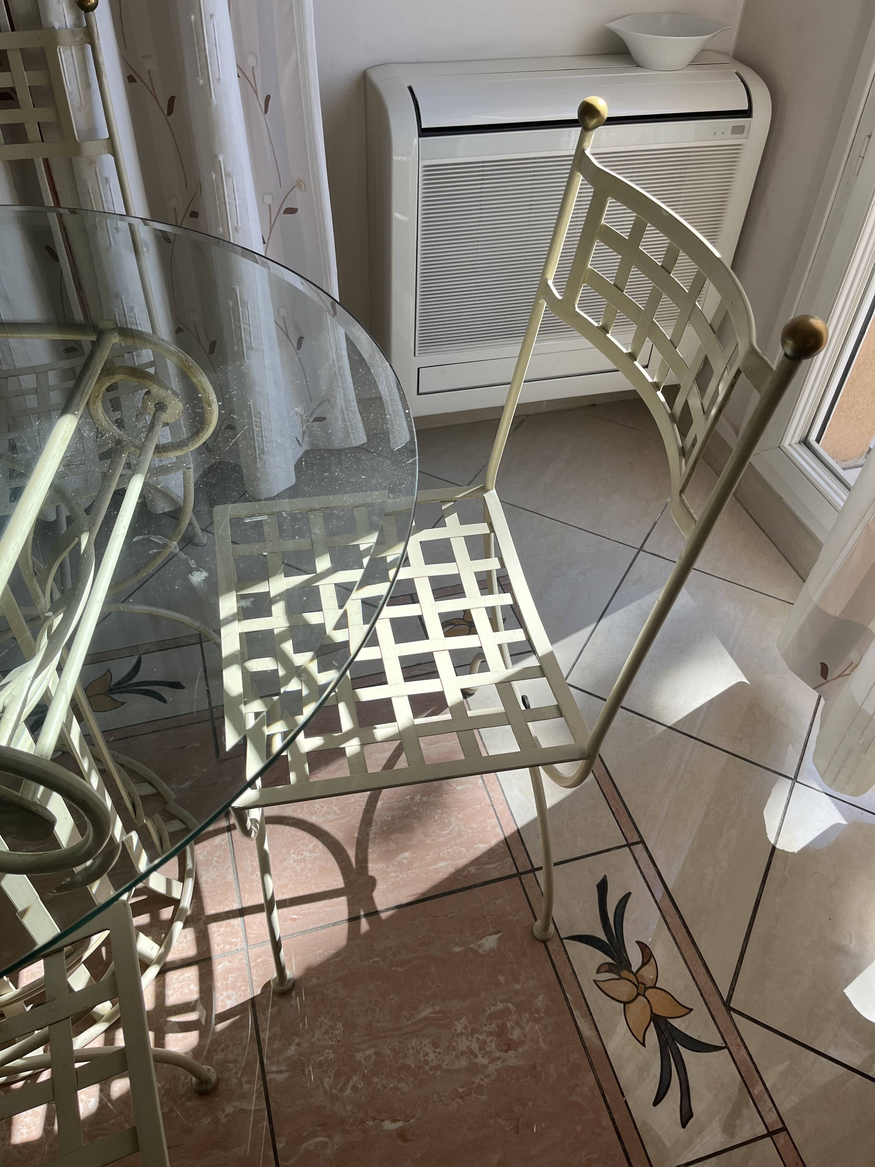 Wrought iron round table and 4 chairs