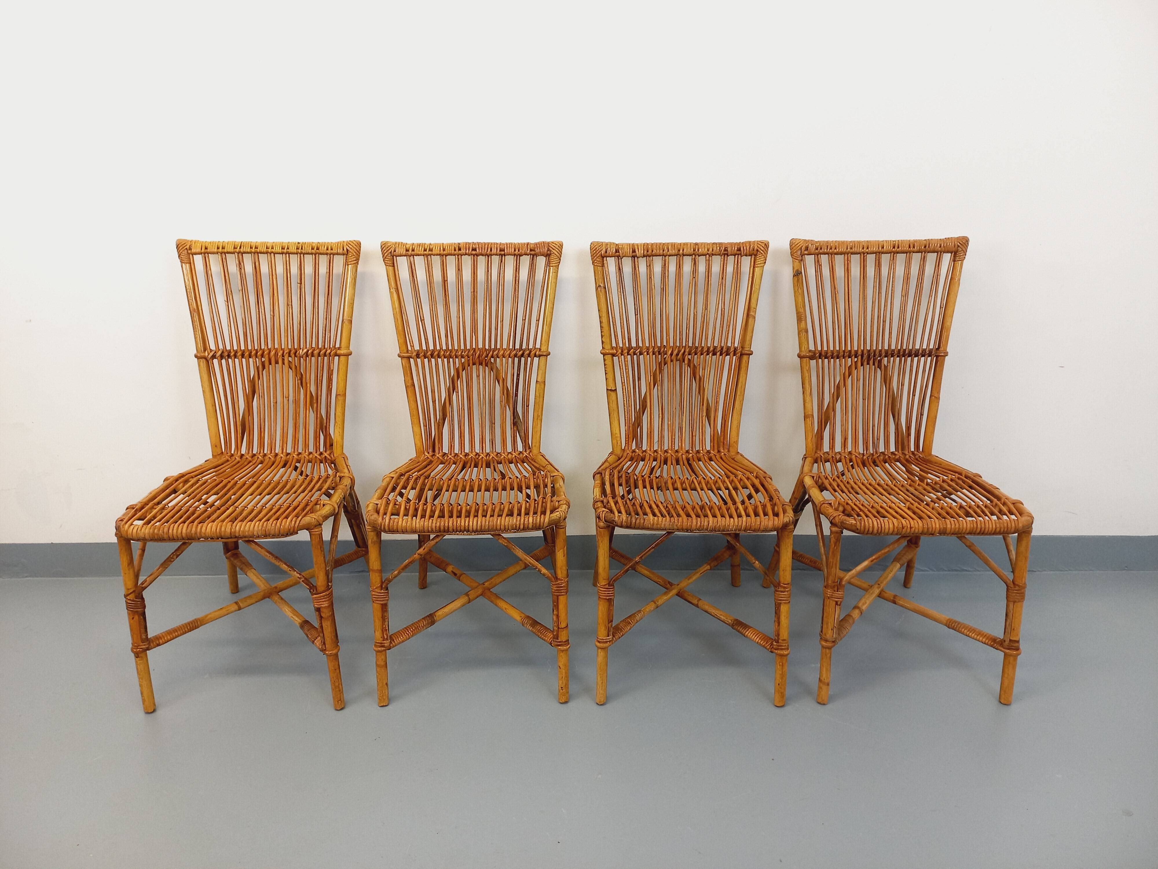 Set of 4 vintage Audoux Minet rattan chairs from the 1950s and 60s.