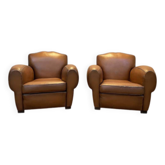 Paire de fauteuils club en cuir art déco