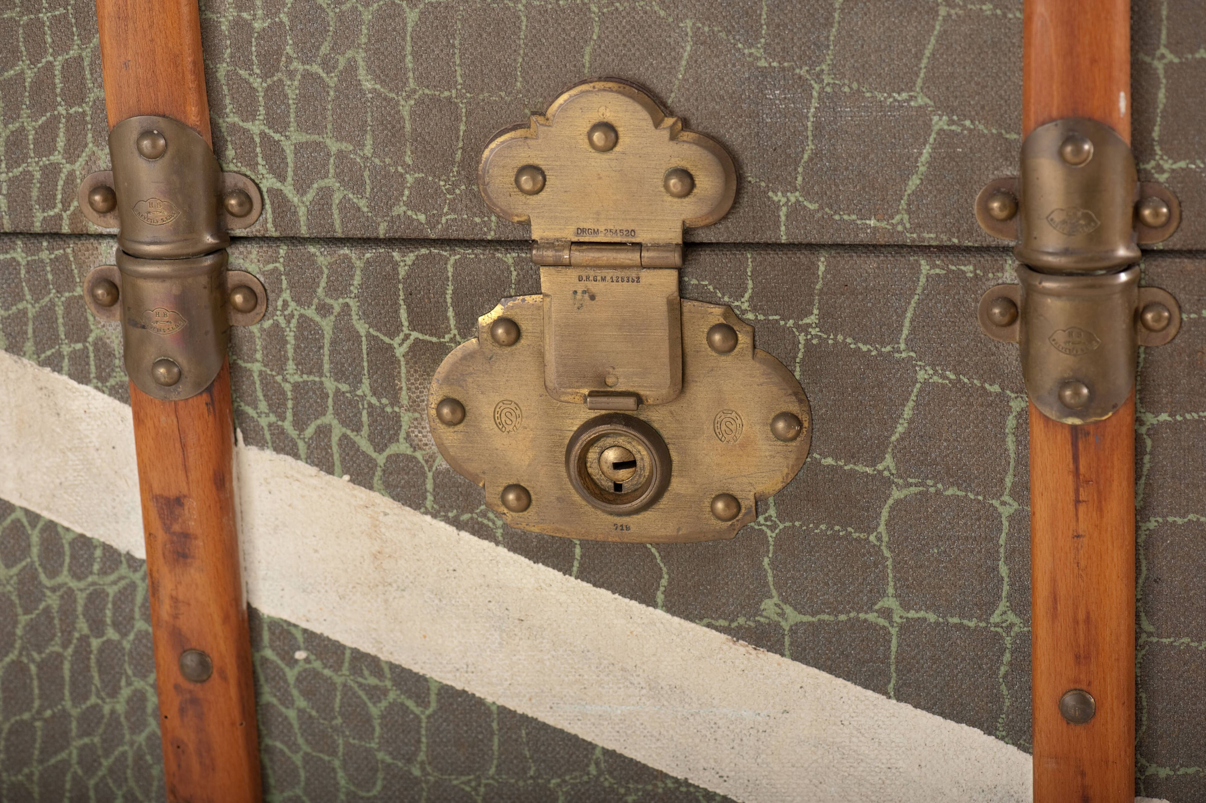 Anc Large cabin trunk in khaki canvas with a snakeskin effect, wood & brass