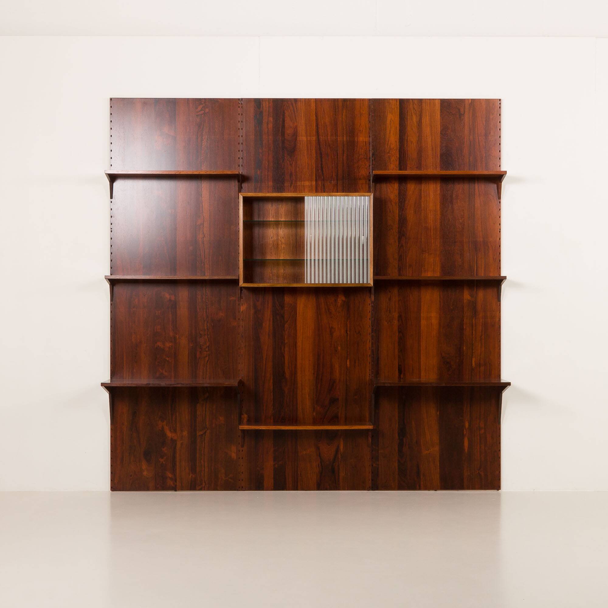 Poul Cadovius rosewood wall unit on panels for Cado, Denmark 1960s