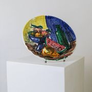 Multicolored hand-painted ceramic wall plate with 1960s Italian fruit motif, signed Stile