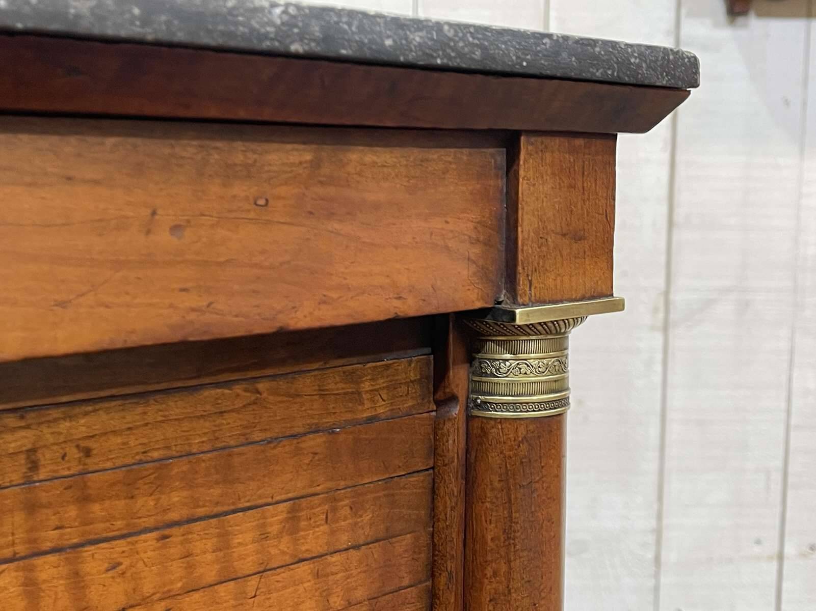 Empire bedside table from the 19th century in cherry wood and black marble.