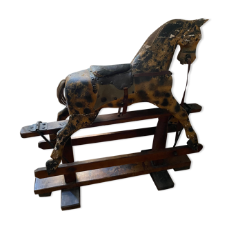 Antique wooden and leather rocking horse