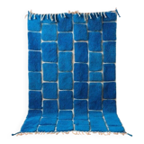Handmade traditional pure wool carpet with blue patterns.