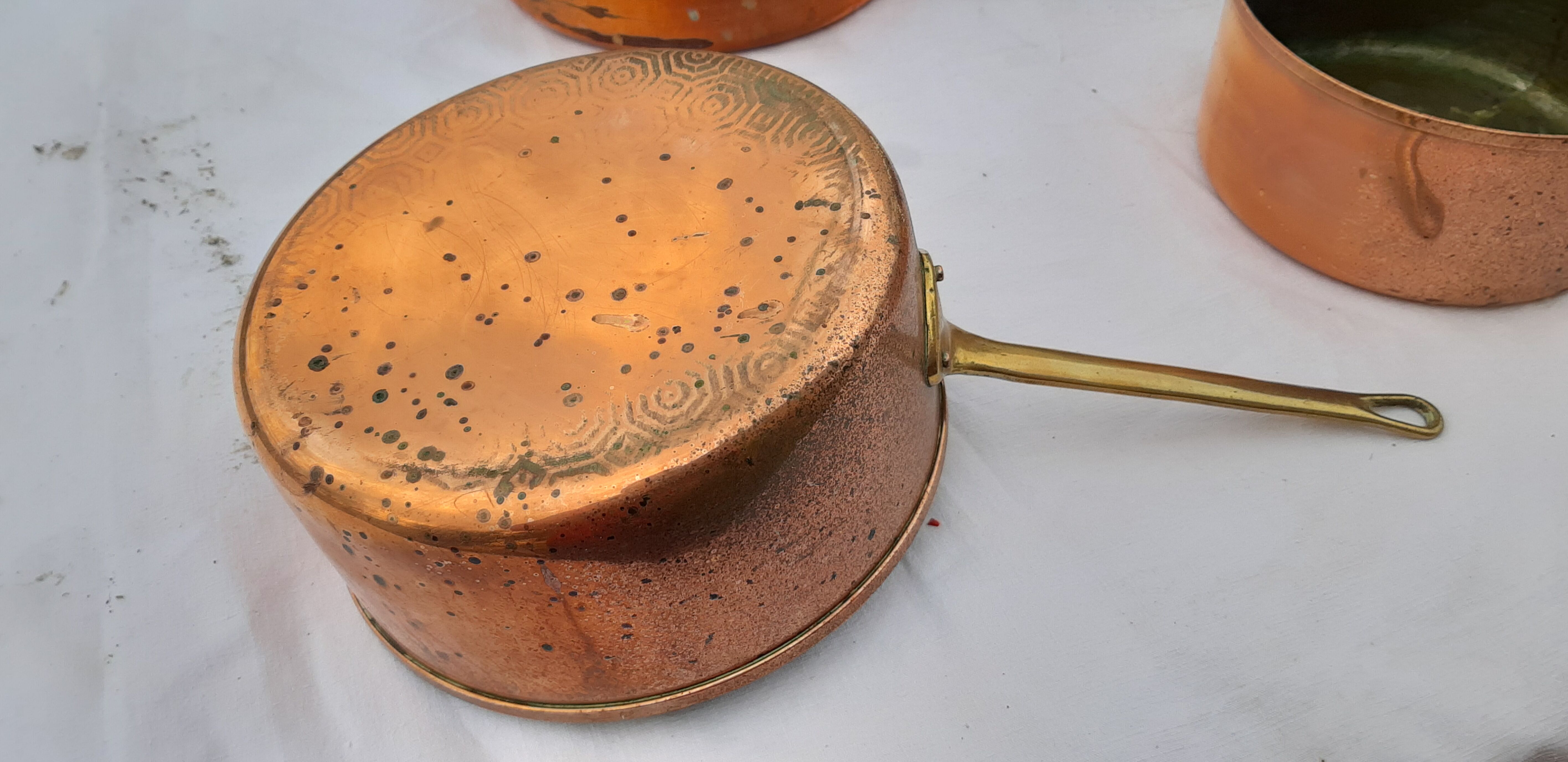 Lots of tinned copper kitchen utensils