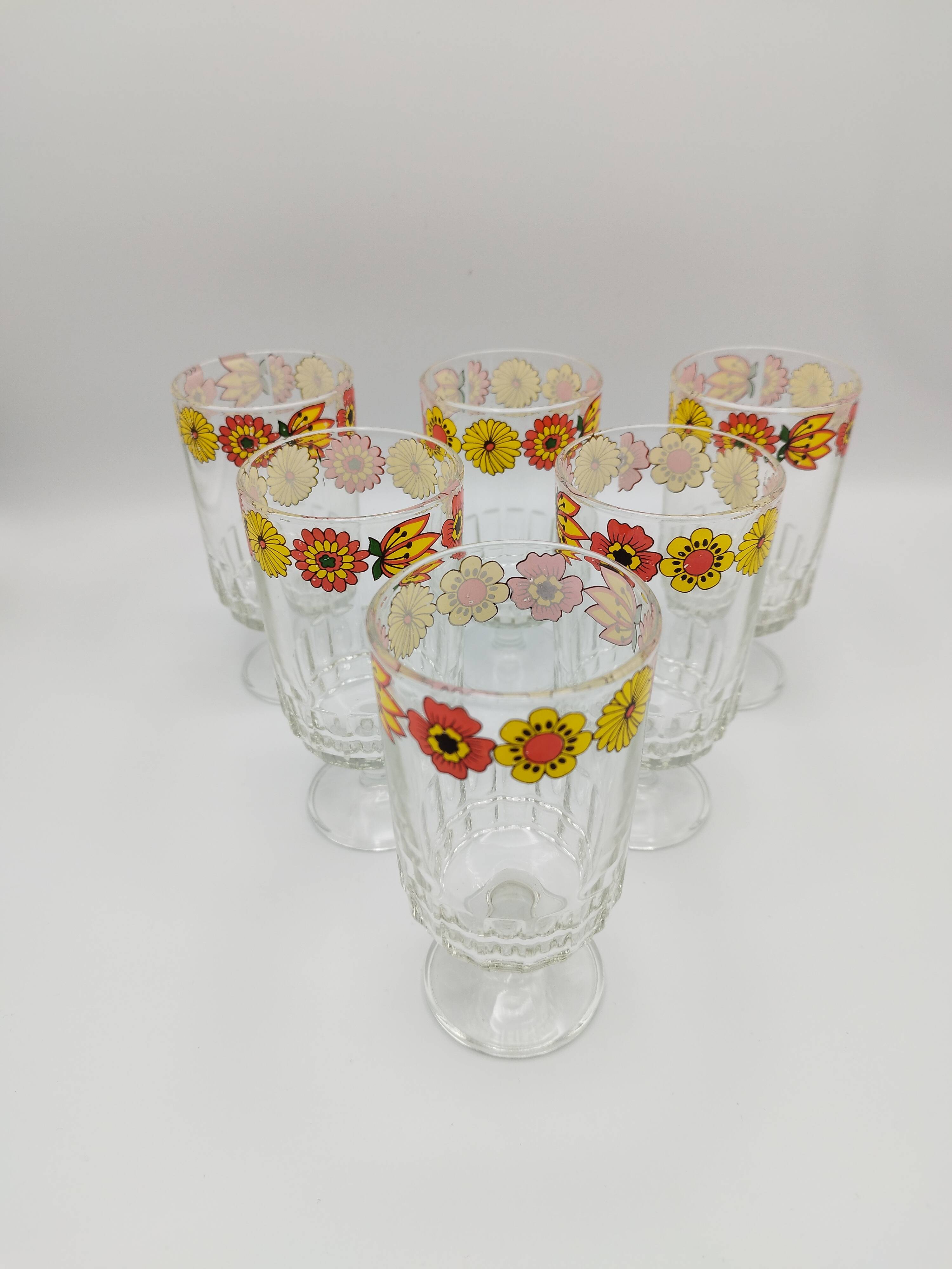 Vintage stemmed glass with floral decoration