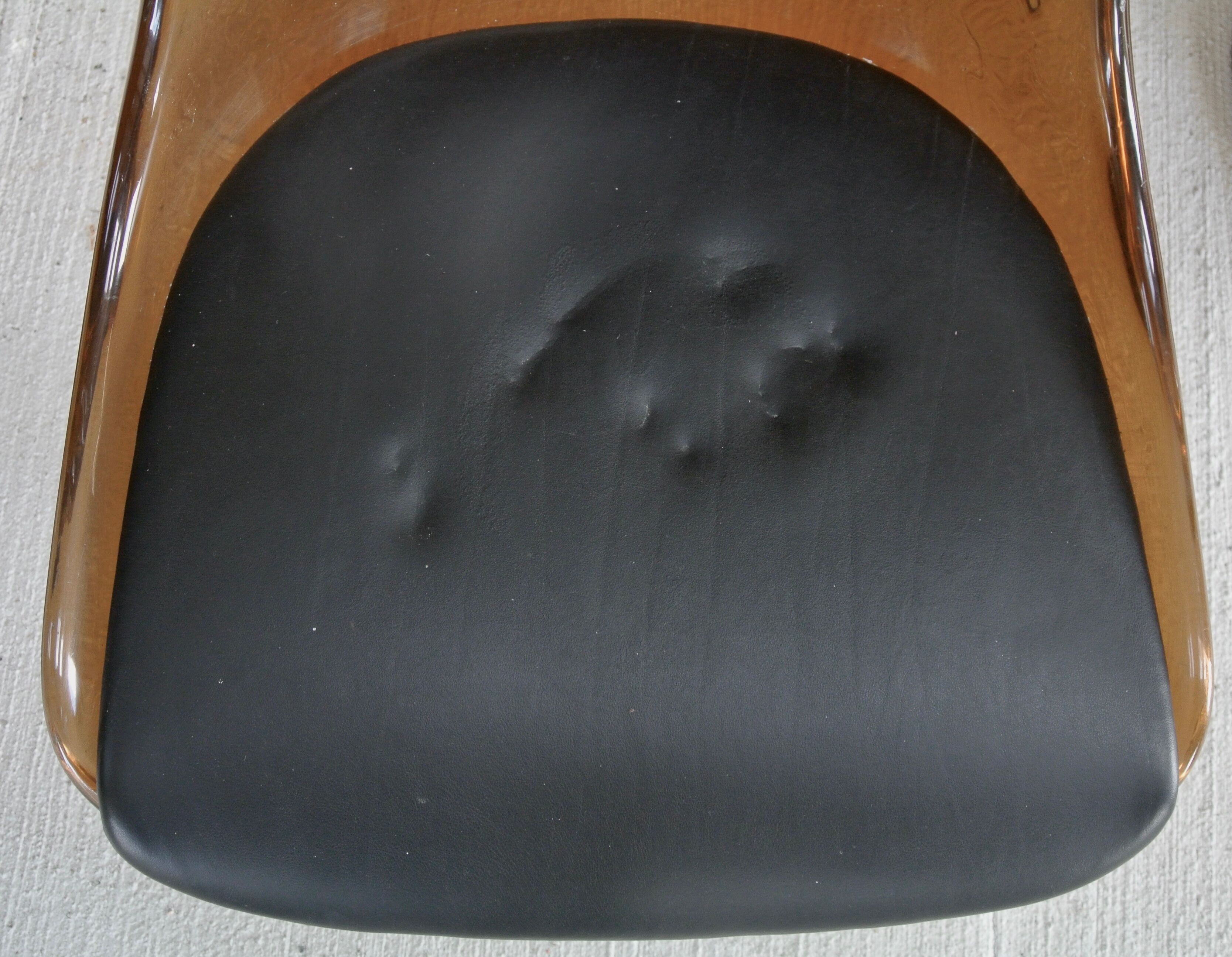 Four swivel chairs - metal base - smoked brown plexi shell - black skaï seat