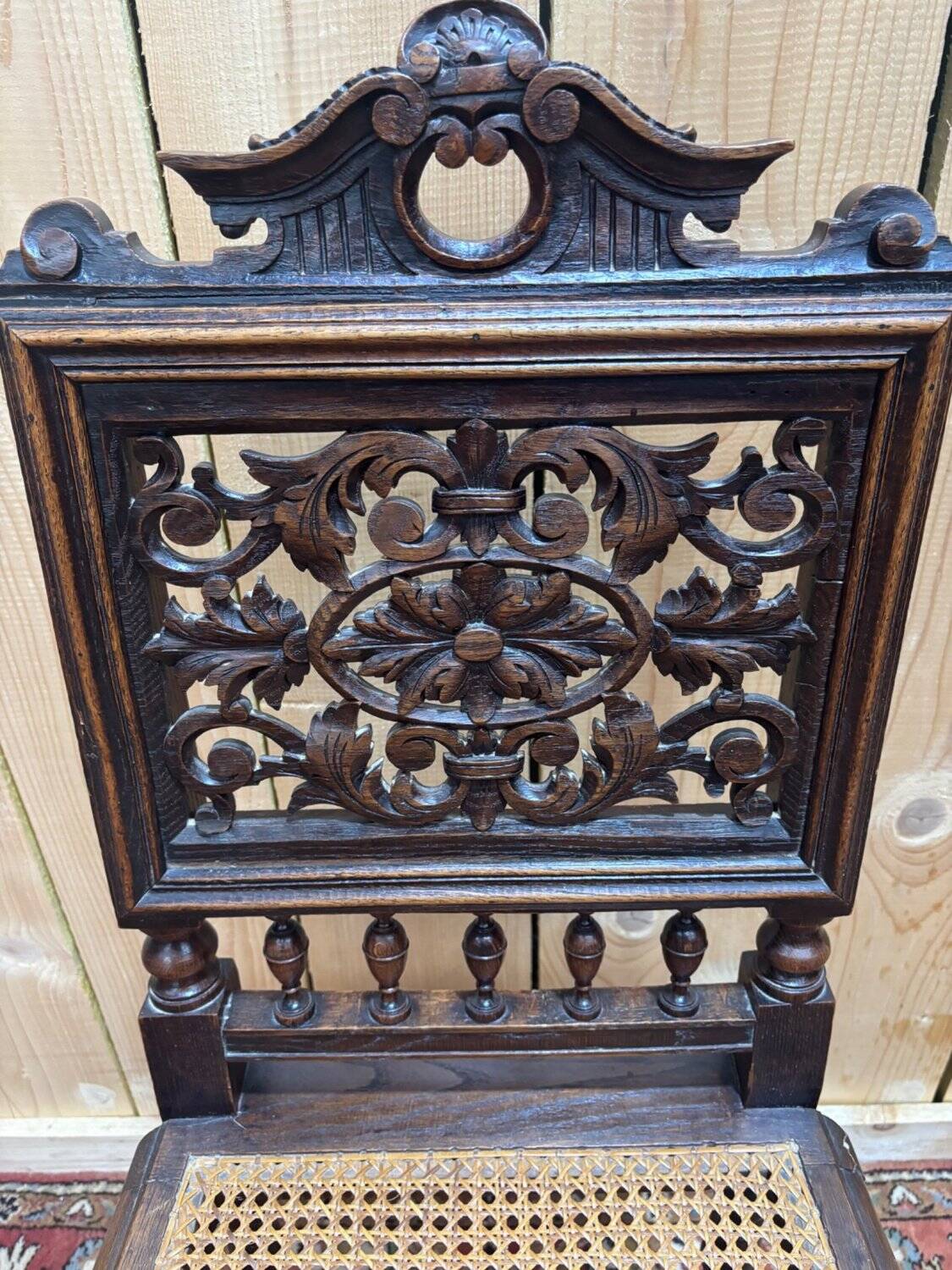 6 High Era chairs in carved solid oak and rattan caning.