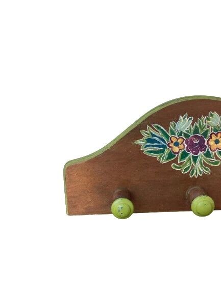 The wooden coat rack with floral motif