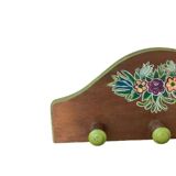 The wooden coat rack with floral motif
