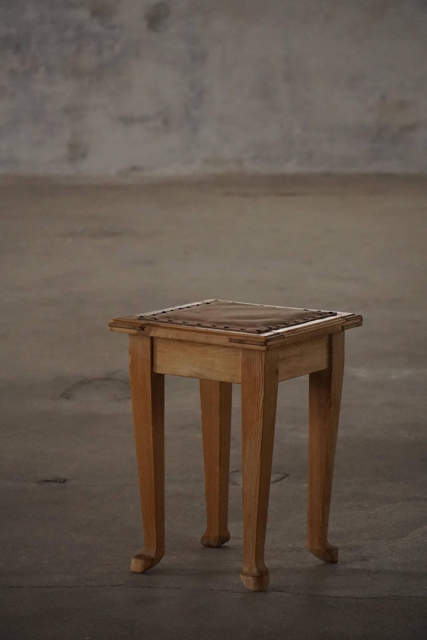 A pair of antique Danish pine stools from the late 19th century.