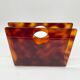 Lucite magazine rack "tortoiseshell", 1970s
