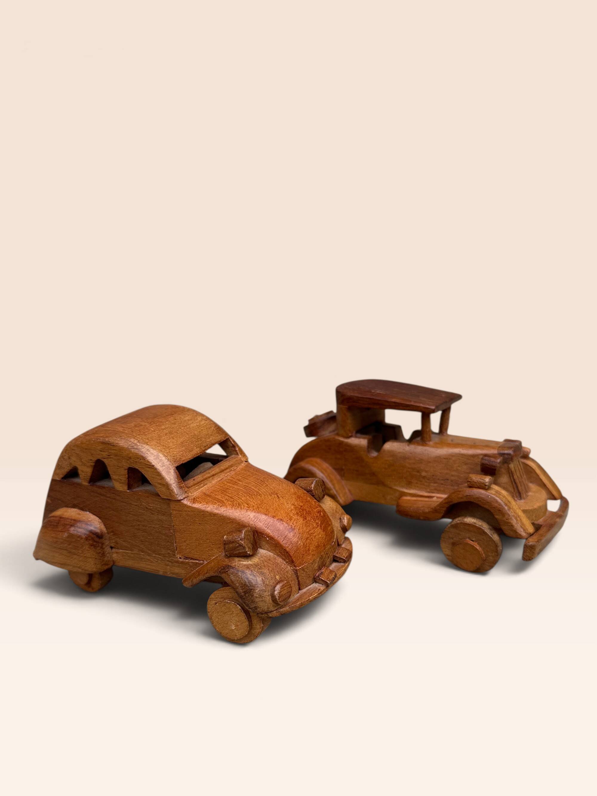 Pair of small handcrafted wooden cars