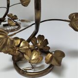 Pair of brass candle holders decorated with patinated metal flowers