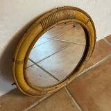 Old rattan mirror with porthole shape